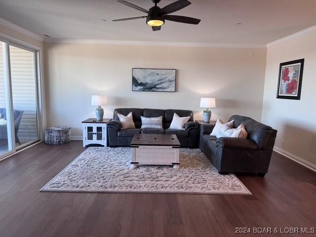 living room featuring ceiling fan, crown molding, and dark hardwood / wood-style floors