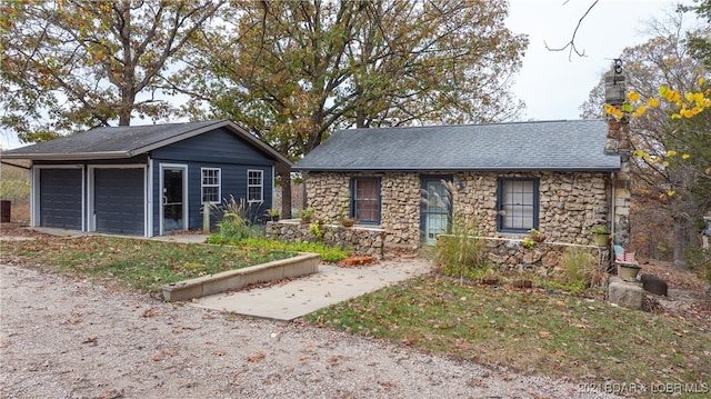 ranch-style home featuring a garage