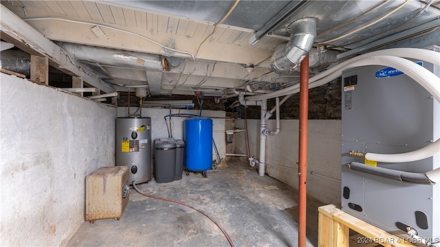 unfinished basement featuring water heater and heating unit