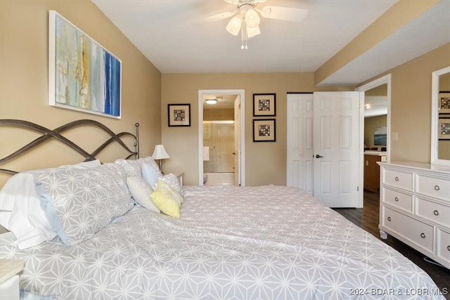 bedroom with dark hardwood / wood-style floors, ceiling fan, and ensuite bath