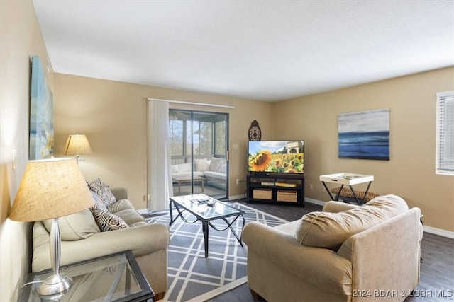 living room with dark hardwood / wood-style flooring