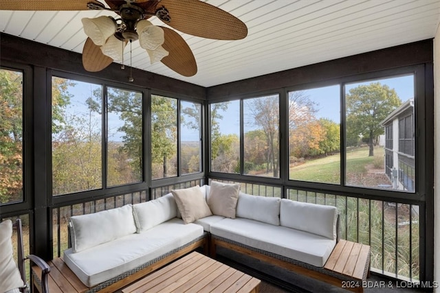 sunroom featuring ceiling fan and a healthy amount of sunlight