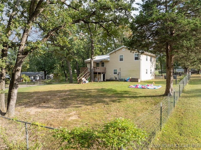 view of yard featuring a wooden deck