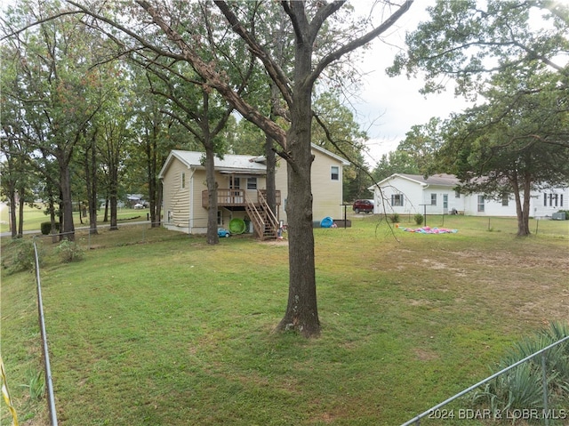 view of yard featuring a wooden deck