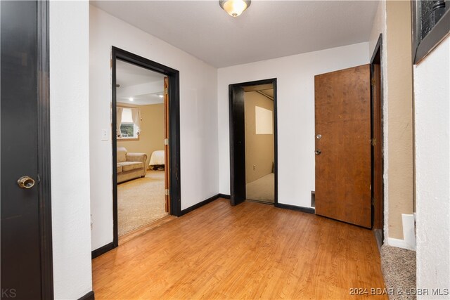 hall with light wood-type flooring