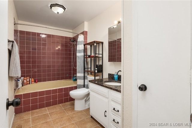 full bathroom featuring tile patterned flooring, vanity, toilet, and shower / tub combo