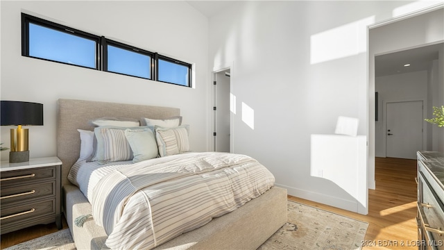 bedroom featuring light wood-type flooring