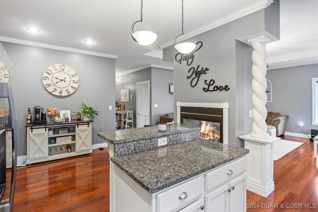 kitchen with white cabinetry, pendant lighting, dark wood-type flooring, and a center island