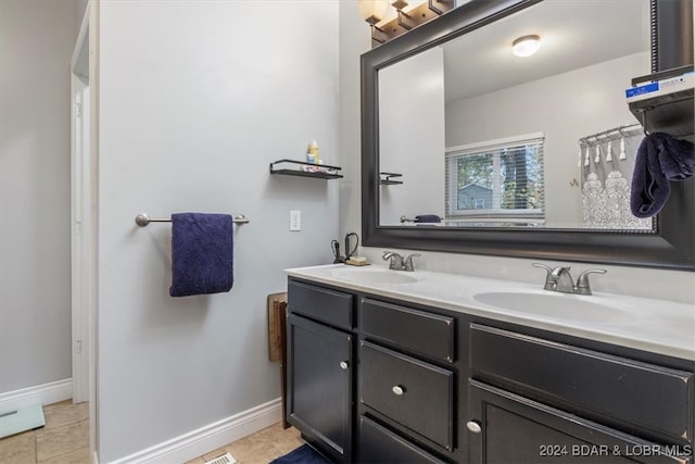 bathroom with vanity and tile patterned floors