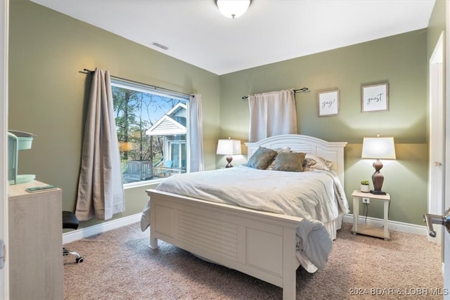 bedroom with light carpet