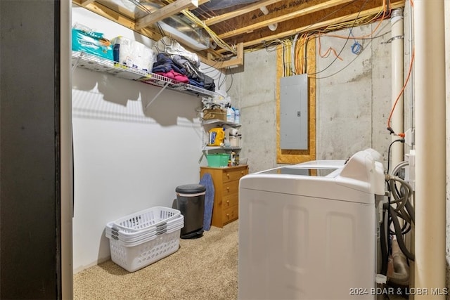 clothes washing area featuring washer / dryer and electric panel