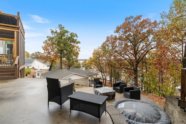 view of patio with an outbuilding and an outdoor hangout area