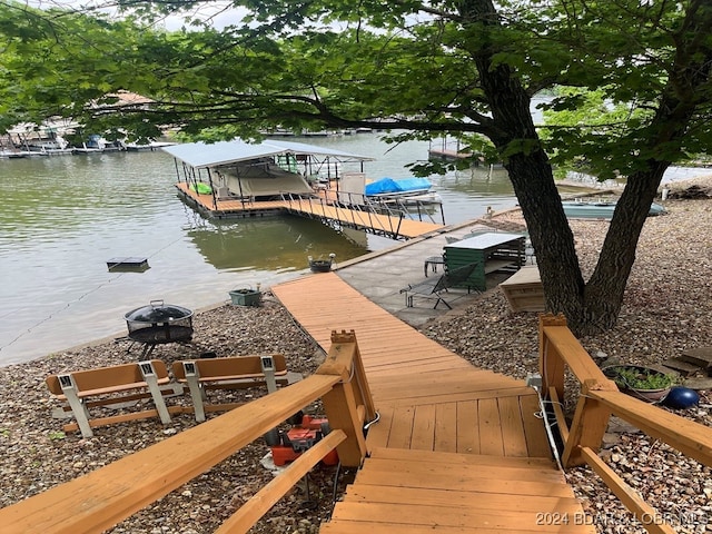 view of dock featuring cooling unit and a water view