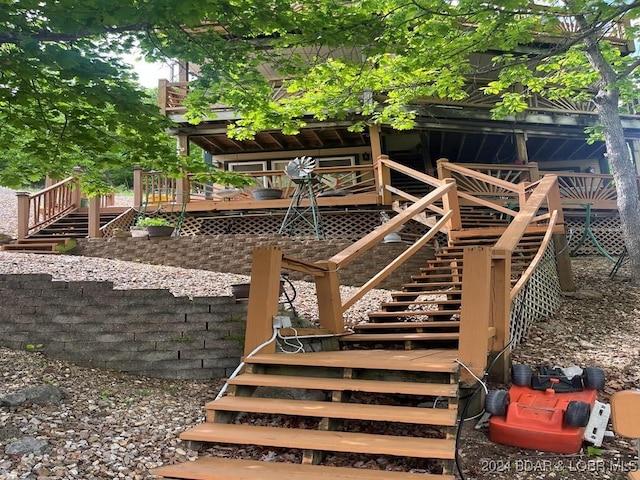 view of yard featuring stairway and a deck