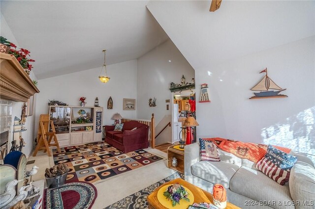 carpeted living room featuring vaulted ceiling and a fireplace