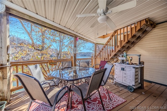 wooden terrace featuring ceiling fan