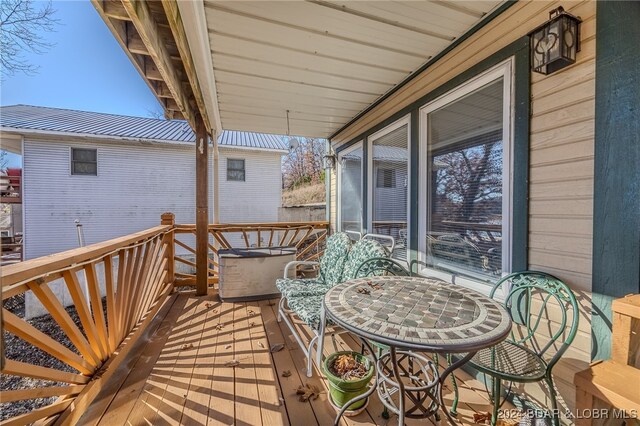 wooden balcony featuring a deck