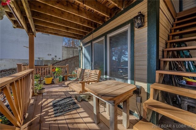 wooden balcony featuring a deck