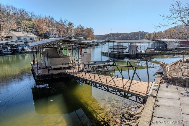 dock area featuring a water view and boat lift