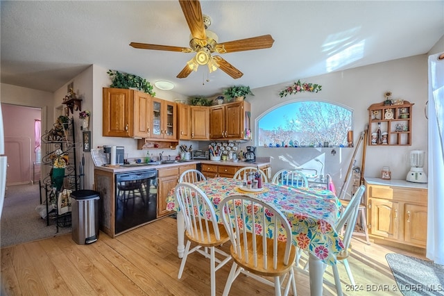 kitchen with ceiling fan, light hardwood / wood-style floors, dishwasher, and sink