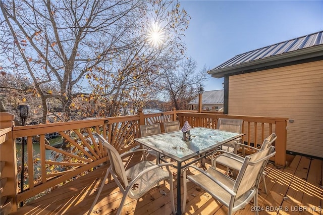 wooden terrace with outdoor dining area