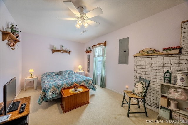 bedroom featuring ceiling fan, light colored carpet, and electric panel