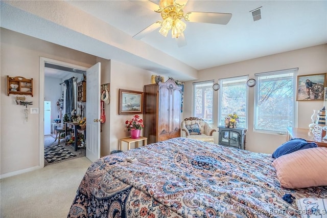 bedroom featuring carpet, visible vents, ceiling fan, and baseboards