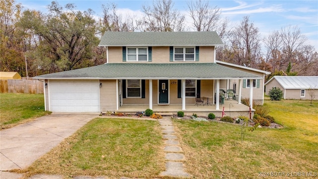 farmhouse-style home with a porch, a front yard, and a garage