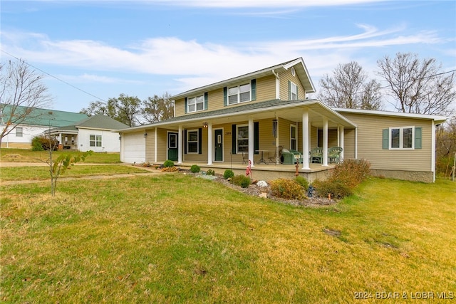 country-style home featuring a garage, a front yard, and covered porch