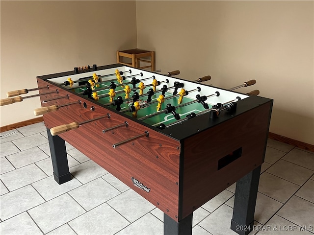 game room featuring light tile patterned floors