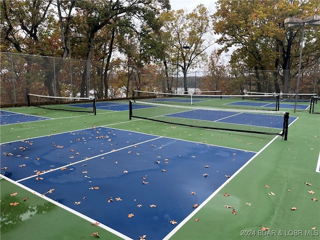 view of sport court with basketball hoop