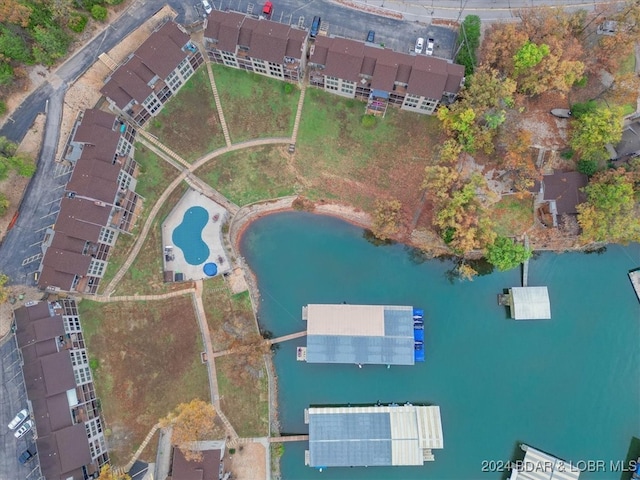 birds eye view of property featuring a water view