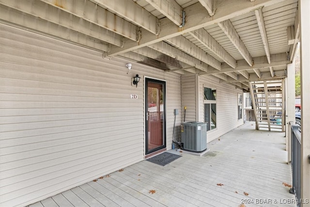 wooden deck with central air condition unit