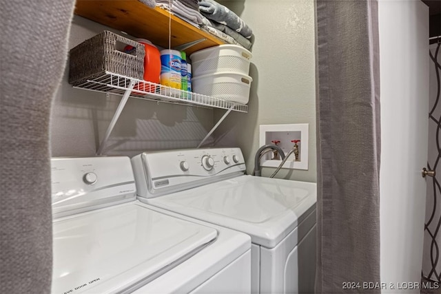 laundry area with independent washer and dryer