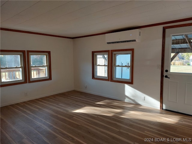 entryway featuring a wealth of natural light, a wall mounted AC, and dark hardwood / wood-style flooring