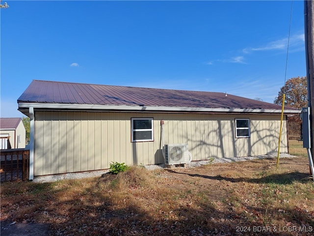 exterior space with ac unit