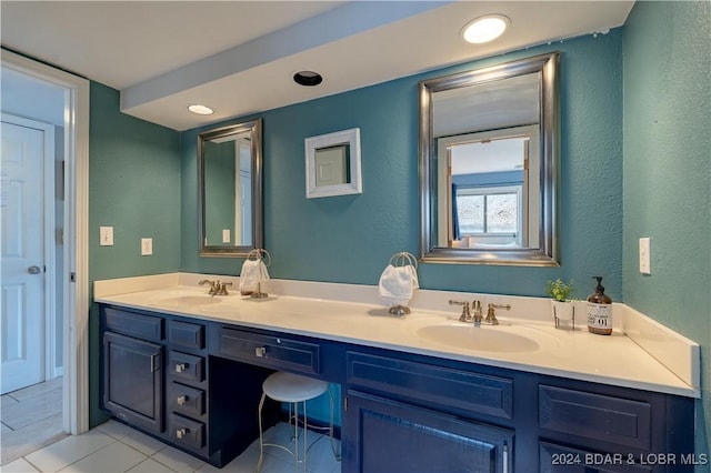 1117 Passover Rd Unit K2, Osage Beach, MO 65065 - bathroom with double vanity, tile patterned flooring, recessed lighting, and a textured wall