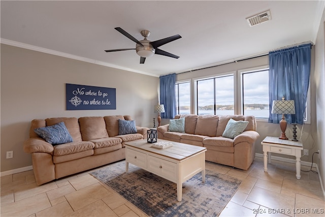 living room with ceiling fan, light tile patterned flooring, and ornamental molding