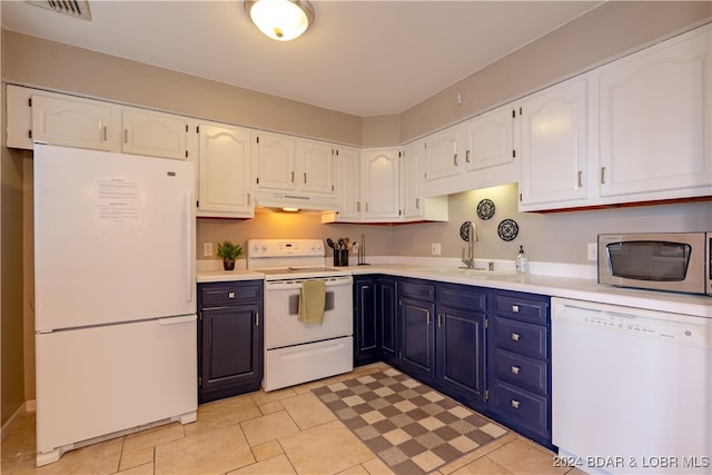 kitchen with white cabinetry, sink, and white appliances