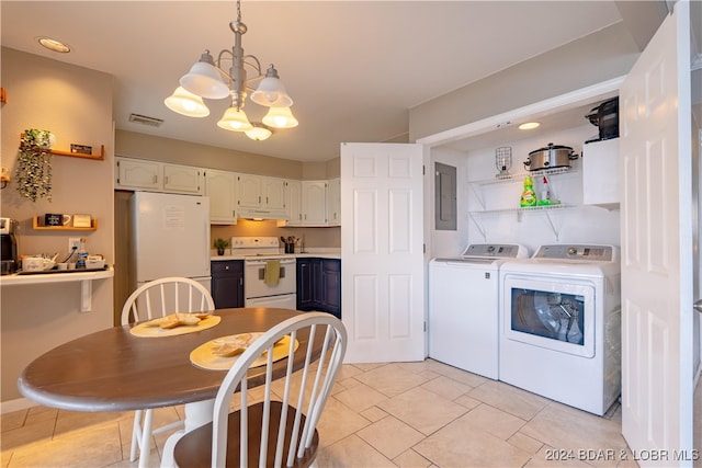 kitchen with pendant lighting, white appliances, independent washer and dryer, white cabinetry, and a chandelier