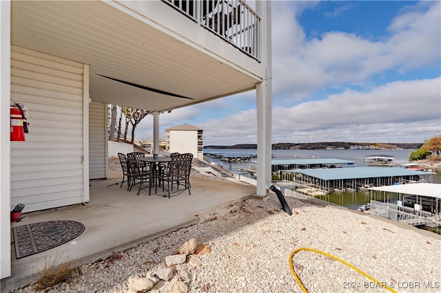 view of patio with a water view