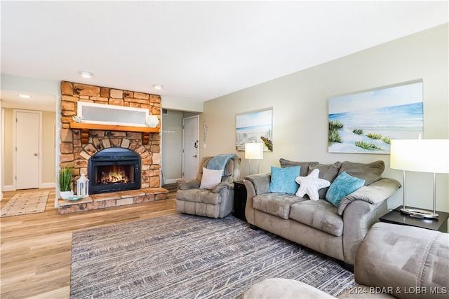 living room featuring a fireplace and hardwood / wood-style flooring