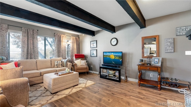 living room with hardwood / wood-style floors and beam ceiling