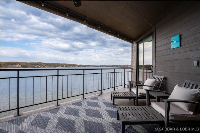 balcony featuring a water view