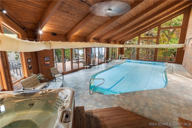 view of swimming pool with a jacuzzi