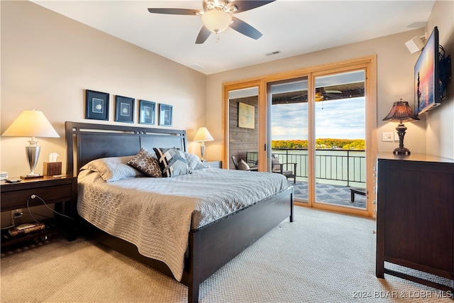 bedroom with access to exterior, light colored carpet, and ceiling fan