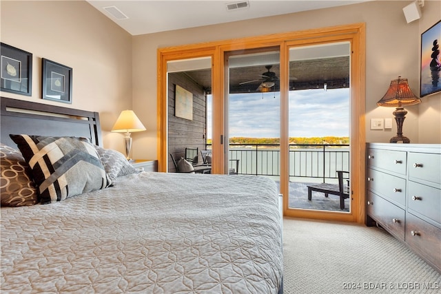 carpeted bedroom featuring access to exterior