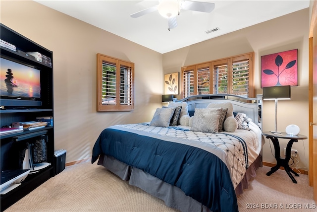 carpeted bedroom featuring ceiling fan