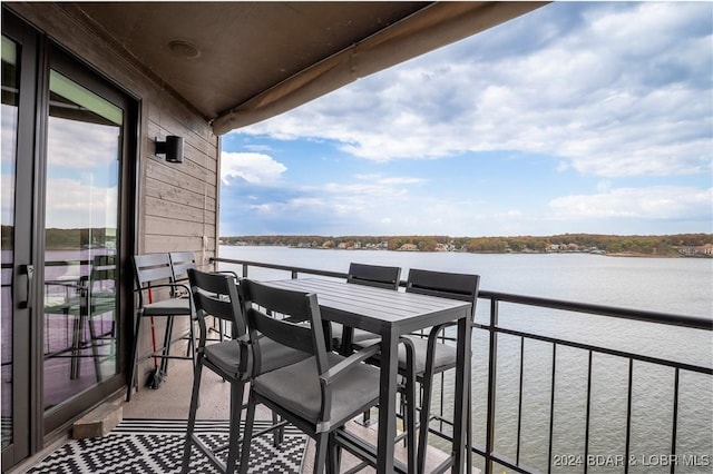 balcony featuring a water view