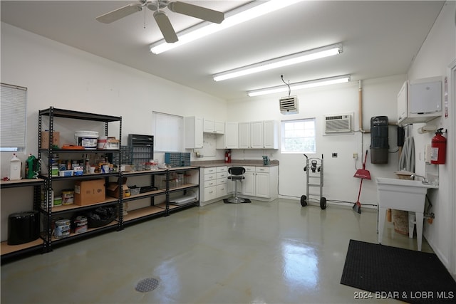 garage with ceiling fan and a wall mounted AC